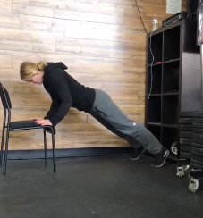 Courtney demonstrating an adapted pushup