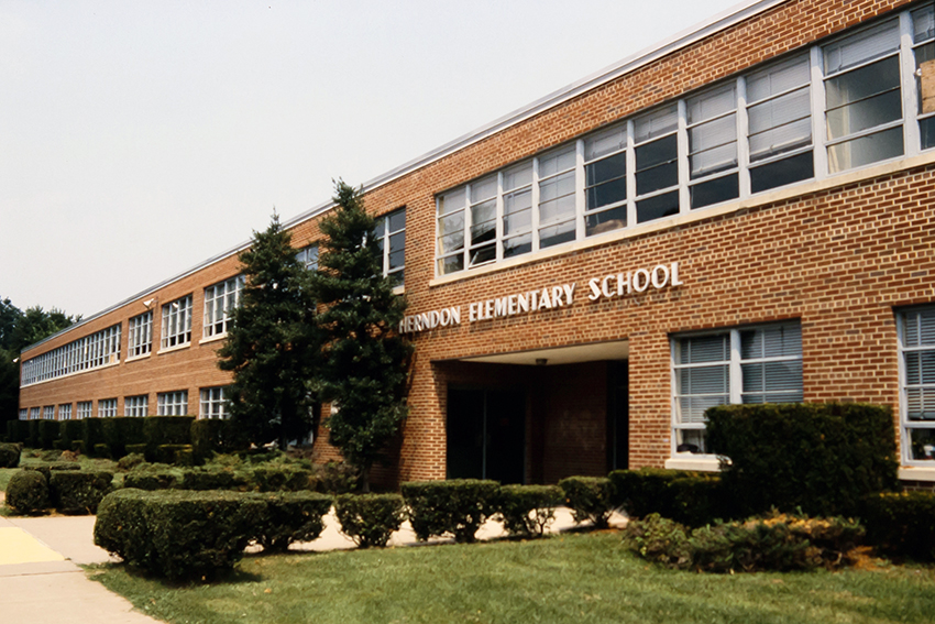 Photograph of the front of Herndon Elementary School showing the main entrance.