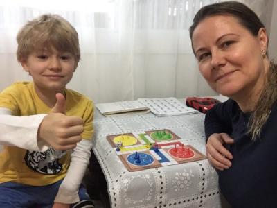 Mom and son playing board game
