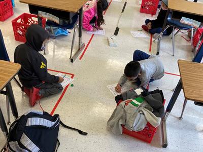 First grade students played math games at a safe distance.