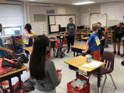 5th grade students are making a human circle to show a chord, a radius, a diameter, and the circumference of a circle. 