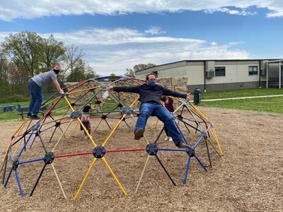 STEAM teacher, Mr. McHenry, is enjoying some recess time with the students.