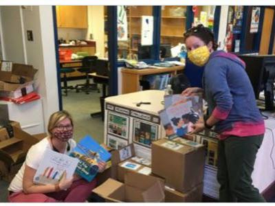 Thanks to donations to our PTA, they were able to purchase boxes of books for the library.  Shown: Ms. Richardson (right) and Ms. Page (left)