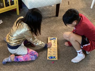 Ms. Choi's kids playing board games